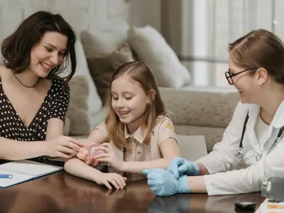 Mother And Daughter With Doctor Pexels