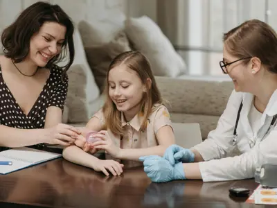Mother And Daughter With Doctor Pexels