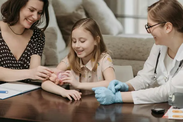 Mother And Daughter With Doctor Pexels